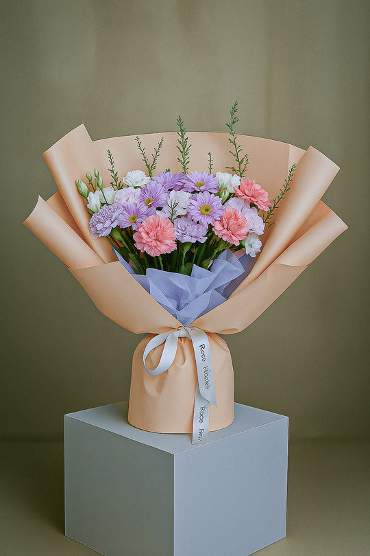 Mixed Bouquet: Bright Flowers in Orange Wrapping | Daisy Florist