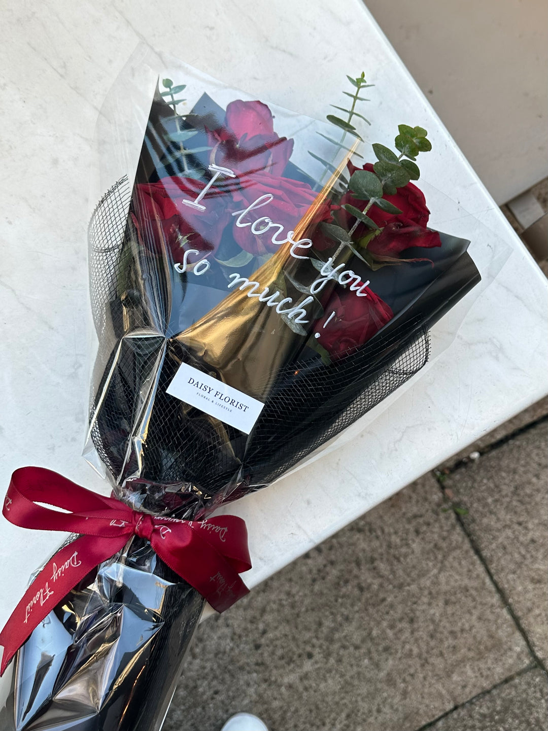 Crimson Kiss Cluster: Red Roses with Foliage | Daisy Florist