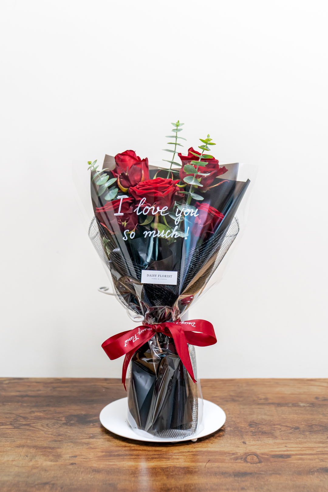 Crimson Kiss Cluster: Red Roses with Foliage | Daisy Florist