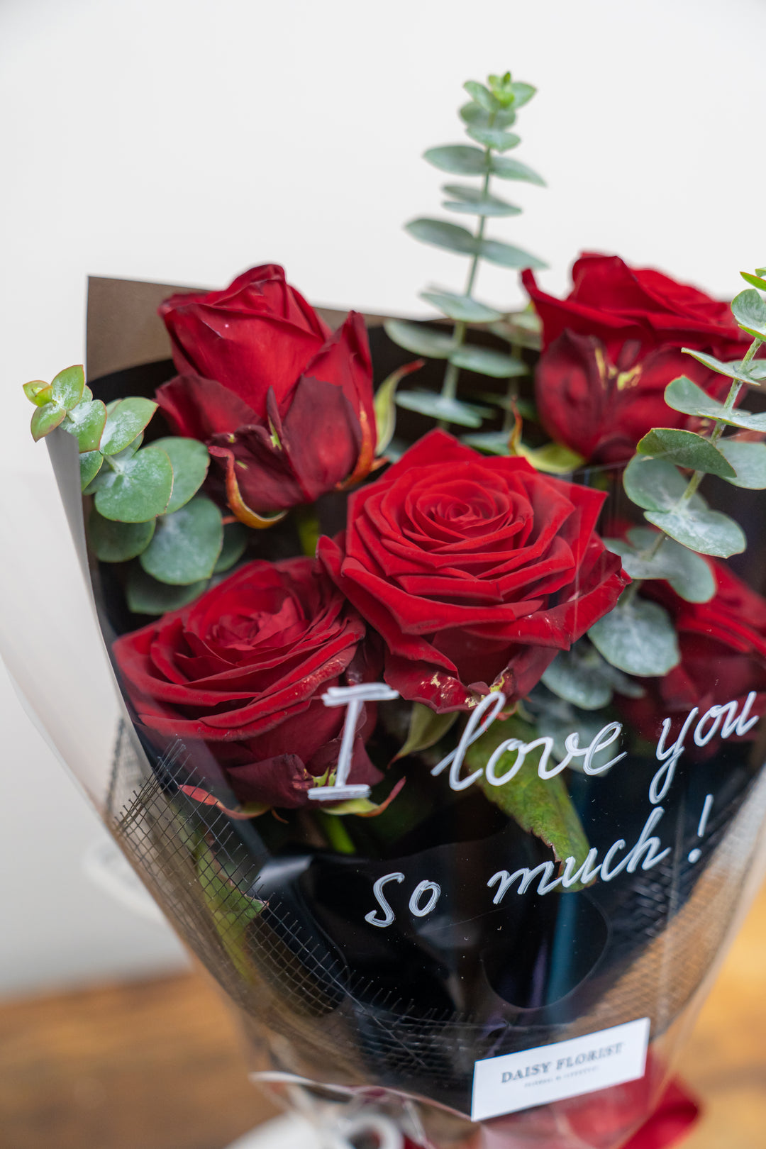 Crimson Kiss Cluster: Red Roses with Foliage | Daisy Florist