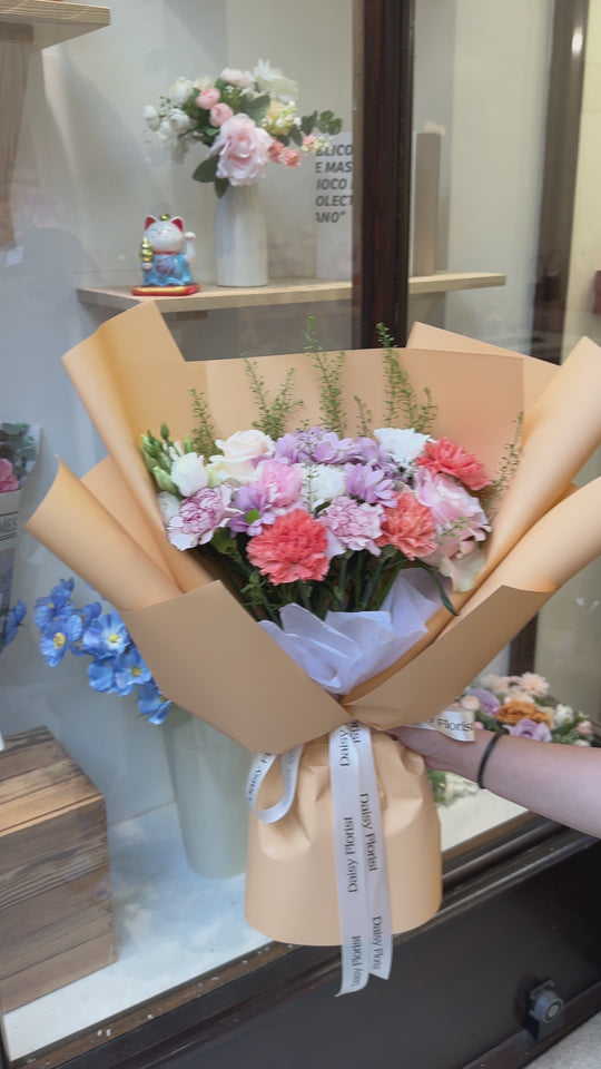 Mixed Bouquet: Bright Flowers in Orange Wrapping | Daisy Florist